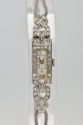 AN EARLY TWENTIETH CENTURY DIAMOND COCKTAIL WATCH, a rectangular diamond case, measuring 23.0mm x