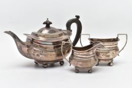 A GEORGE V SILVER THREE PIECE BACHELOR'S TEA SERVICE OF ROUNDED RECTANGULAR OUTLINE, with reeded