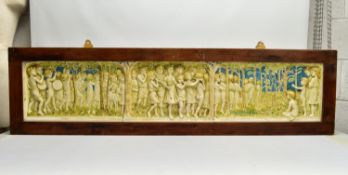 A DELLA ROBBIA THREE SECTION RECTANGULAR PLAQUE MOULDED IN RELIEF WITH A PROCESSION OF CHILDREN