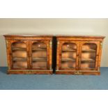 A PAIR OF 19TH CENTURY FRENCH BURR WALNUT AND MARQUETRY INLAID BOOKCASES, the double glazed doors