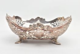 A GEORGE V PIERCED SILVER DISH OF SHAPED RECTANGULAR FORM, wavy rim with cast scrolls above