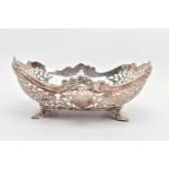 A GEORGE V PIERCED SILVER DISH OF SHAPED RECTANGULAR FORM, wavy rim with cast scrolls above