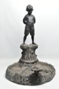 AN EARLY 20TH CENTURY HOLLOW CAST LEAD FIGURAL BIRD BATH, modelled as a boy standing on a tree trunk