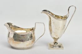 TWO SILVER HELMET SHAPED CREAM JUGS, comprising a George III example with bright cut decoration,