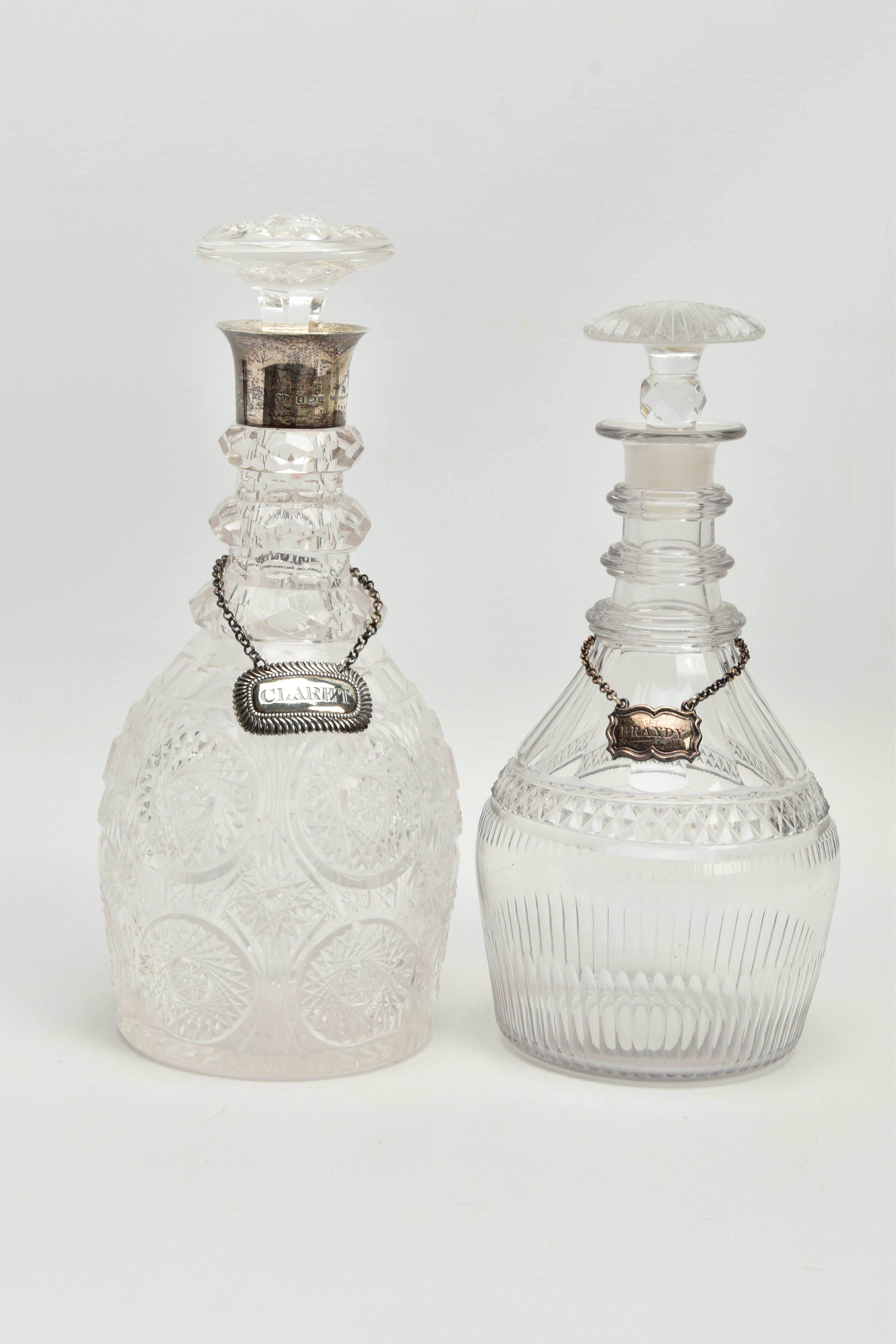 AN EARLY 19TH CENTURY PRUSSIAN SHAPED GLASS DECANTER AND A GEORGE V GLASS DECANTER, the early 19th