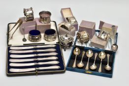 A SET OF SIX INDIVIDUALLY BOXED GEORGE V SILVER NAPKIN RINGS AND A SMALL QUANTITY OF OTHER CASED AND
