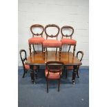 A VICTORIAN MAHOGANY WIND OUT DINING TABLE, with one additional leaf, on cylindrical fluted legs,