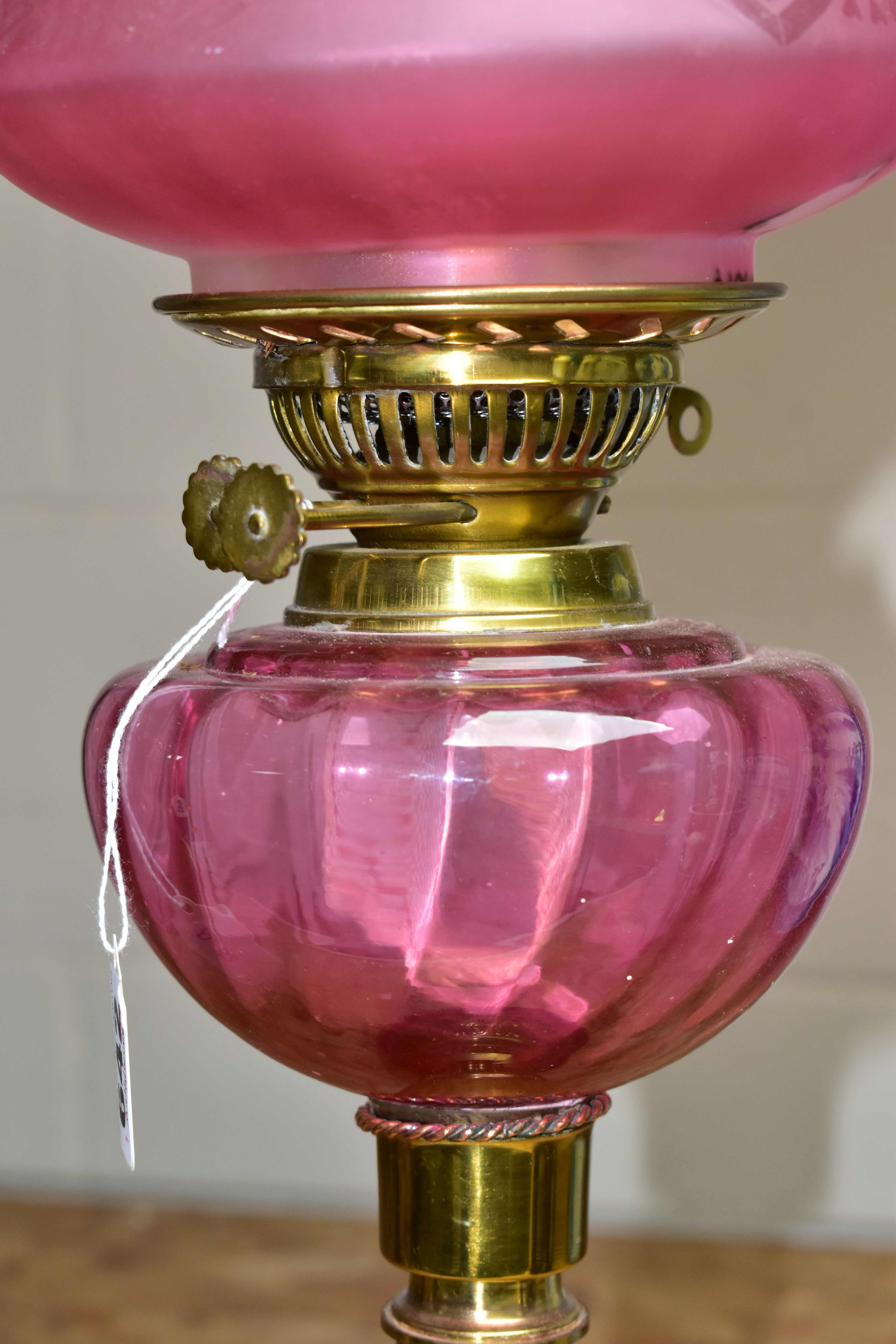 A LATE VICTORIAN BRASS BASED OIL LAMP, the domed acid etched clear and opaque cranberry shade - Image 4 of 4