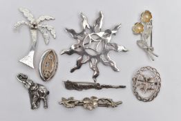 A SELECTION OF SILVER AND WHITE METAL BROOCHES, to include a silver palm tree, hallmarked