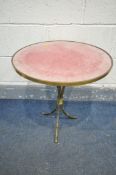 AN EARLY 20TH CENTURY BRASS CIRCULAR BAMBOO EFFECT SIDE TABLE, with a pink baize top surface,