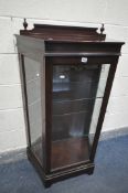 A MAHOGANY DISPLAY CABINET, with raised back, and canted corners, enclosing two glass shelves, width