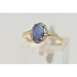 A 9CT GOLD OPAL DOUBLET RING, oval opal cabochon doublet, four claw set in yellow gold, within a