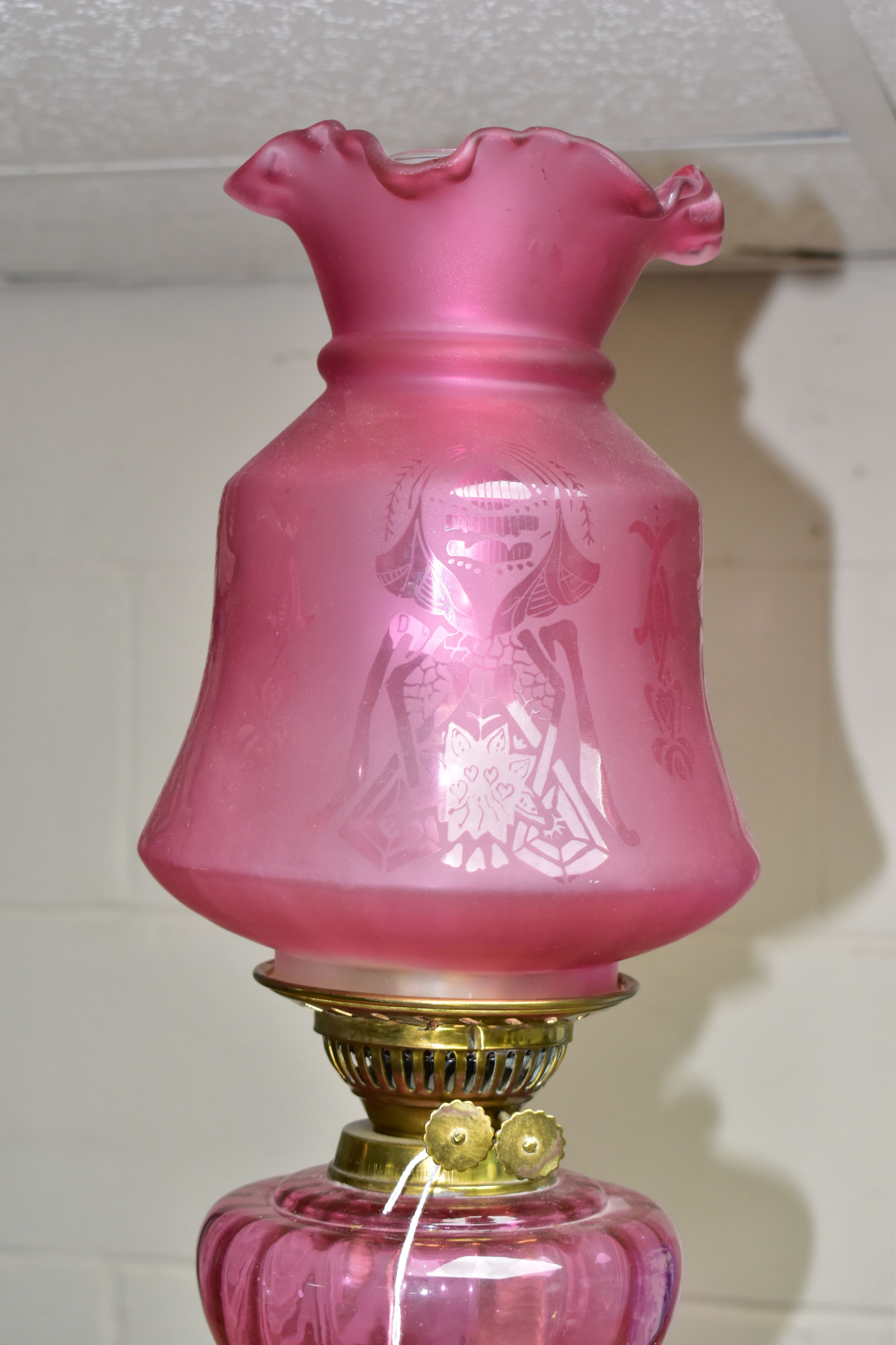 A LATE VICTORIAN BRASS BASED OIL LAMP, the domed acid etched clear and opaque cranberry shade - Image 2 of 4