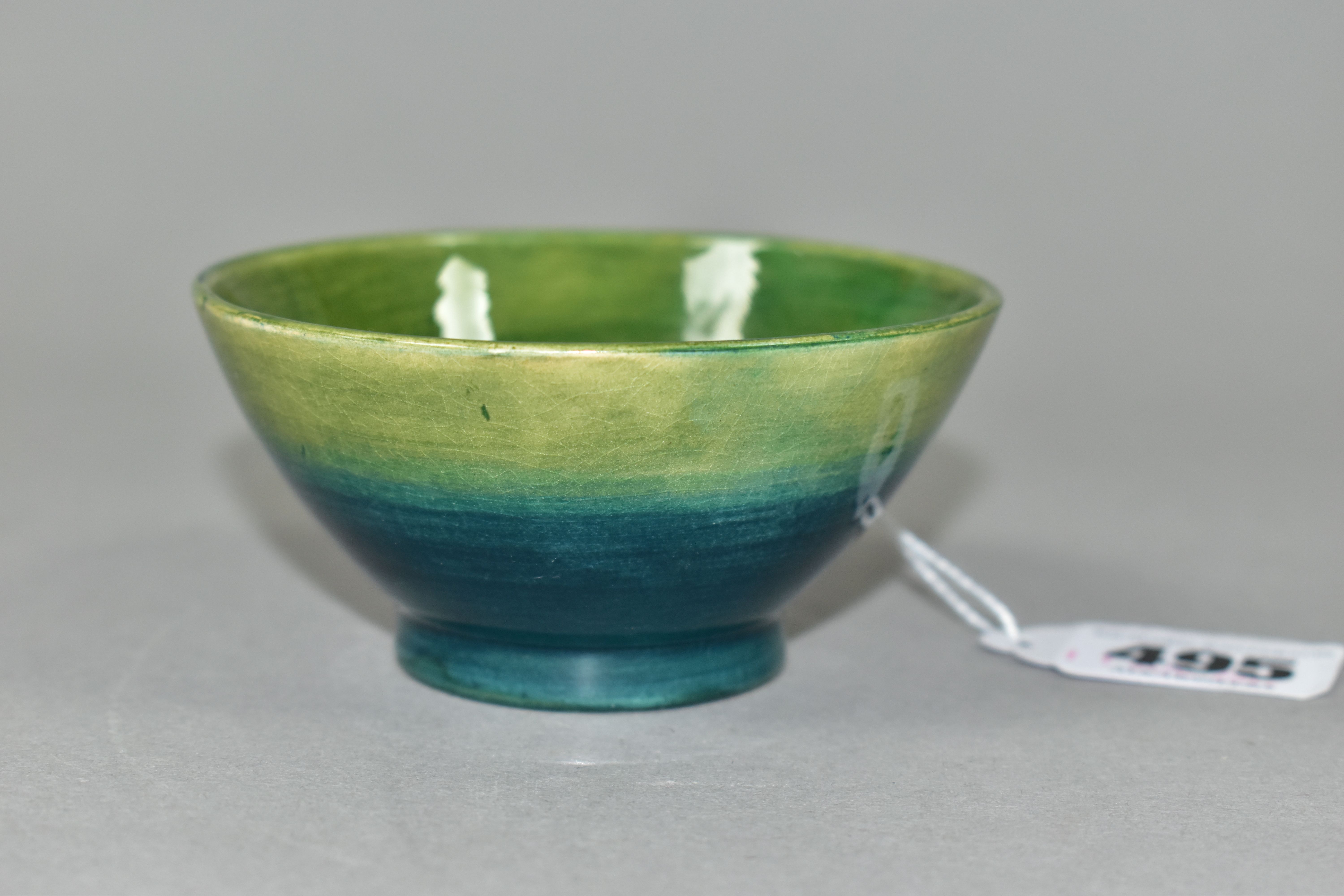 A MOORCROFT POTTERY SMALL FOOTED BOWL, of conical form, in Pansy pattern on a turquoise/green - Image 2 of 3