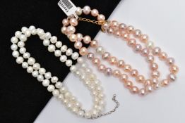 TWO IMITATION PEARL NECKLACES, the first a peachy pink hue oval shape bead necklace, with lobster