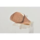 A ROSE GOLD TONE SIGNET RING, shield shape signet with worn engraved initials, misshapen shank