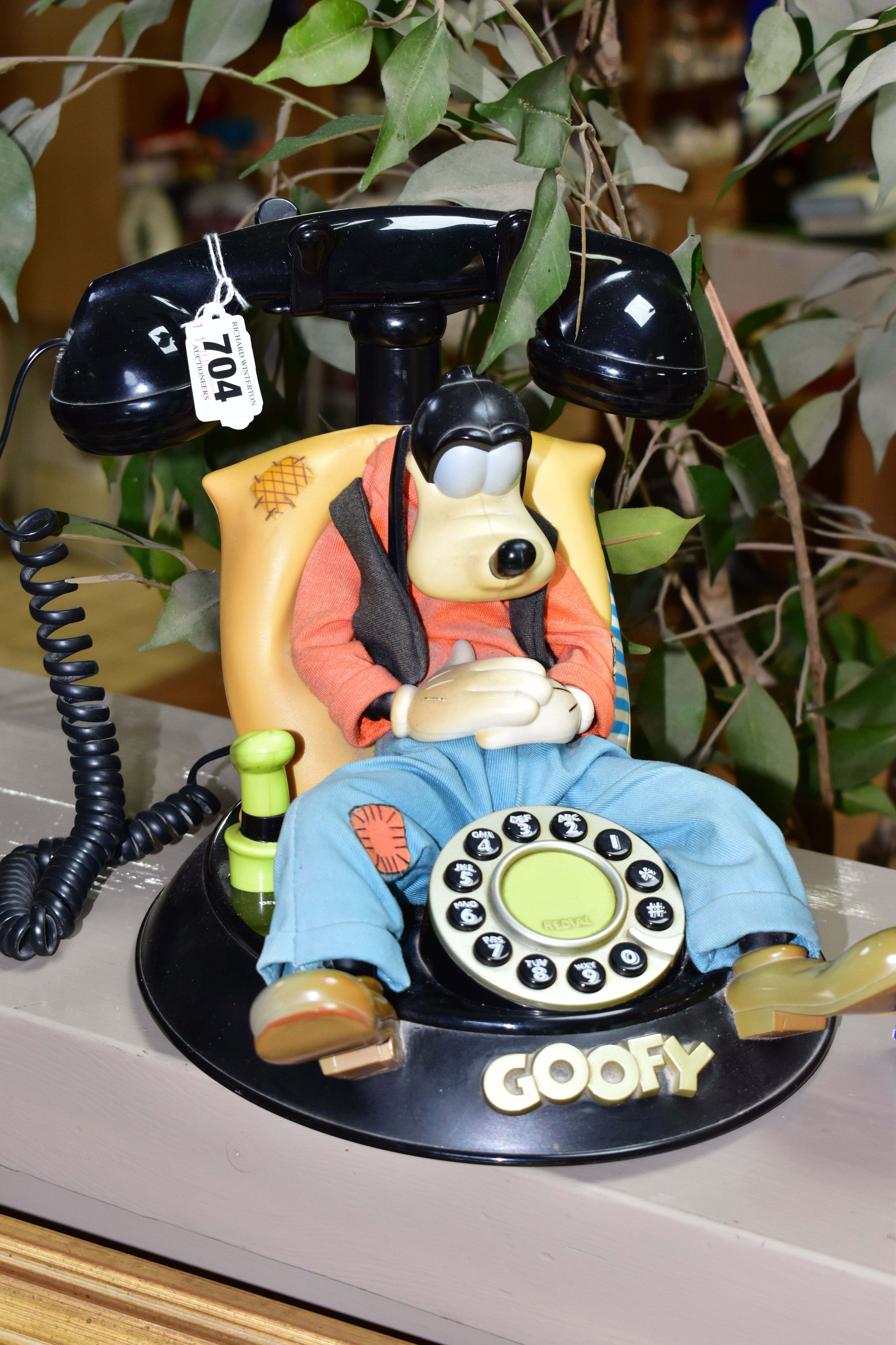 A WARNER BROS 'GOOFY' PUSH BUTTON PHONE (mybelle805), a wind up tin duck on a bike (boxed), also - Image 2 of 3