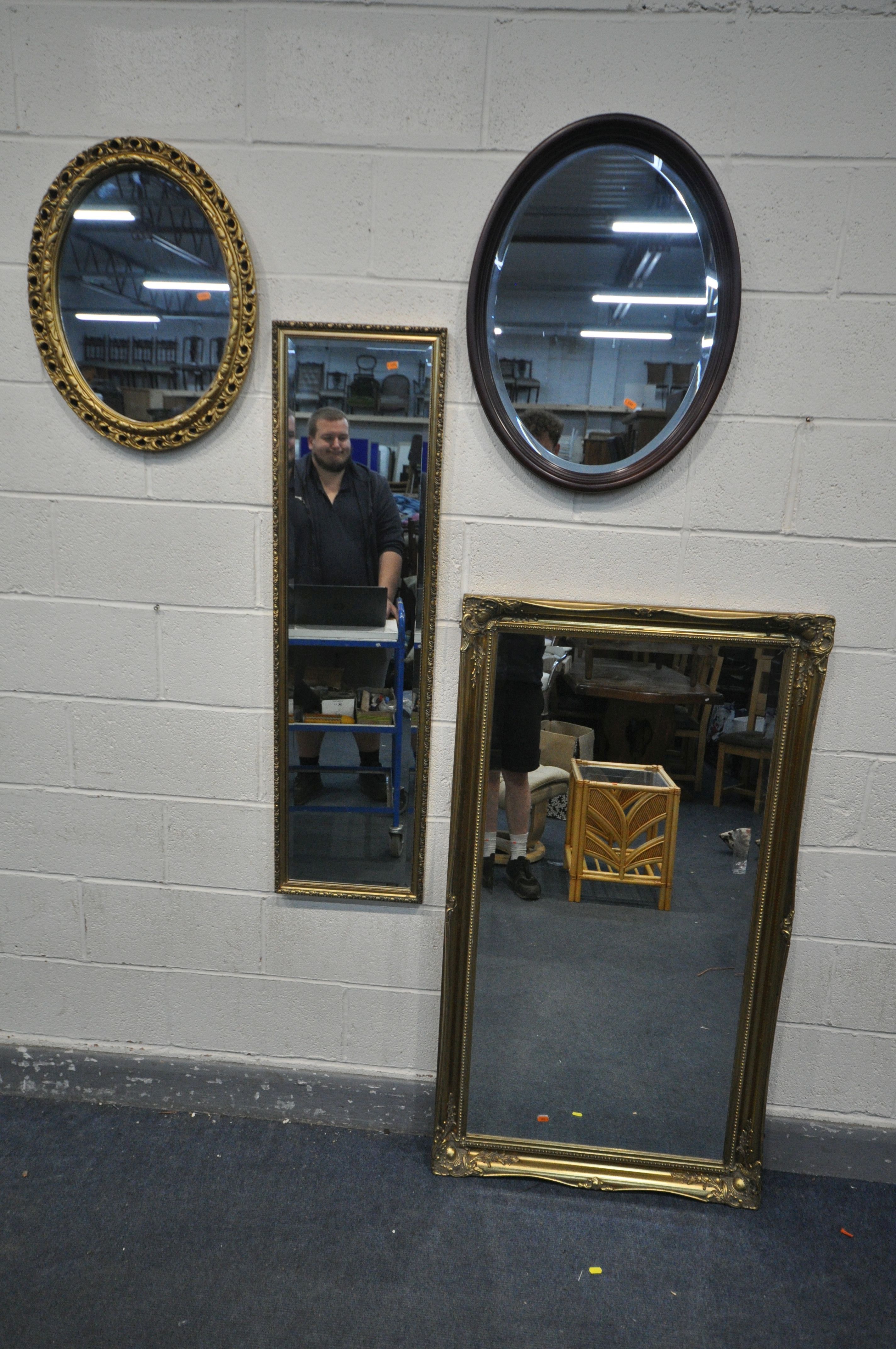 A LARGE RECTANGUALR GILT WOOD WALL MIRROR, with foliate detailing, width 76cm x height 137cm,