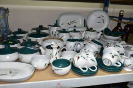 A QUANTITY OF DENBY GREENWHEAT PATTERN DINNERWARES, comprising three tea pots in a variety of sizes,