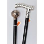 TWO SILVER HANDLED WALKING STICKS, the first a bulbous silver pommel detailed with a floral and