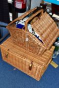 TWO LARGE WICKER PICNIC BASKETS, one containing cutlery, plates and mugs for four, two flasks, two