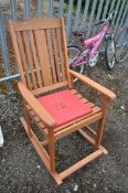 A TEAK GARDEN ROCKING CHAIR