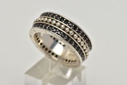 A WIDE WHITE METAL BAND, approximate band width 8.8mm, with a beaded centre between two rows of