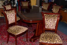 A CHARLES BARR MAHOGANY AND BURR WOOD INLAID EXTENDING PEDESTAL DINING TABLE, with one additional