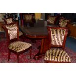 A CHARLES BARR MAHOGANY AND BURR WOOD INLAID EXTENDING PEDESTAL DINING TABLE, with one additional