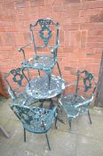 A GREEN PAINTED ALUMINIUM GARDEN TABLE, diameter 60cm x height 69cm and four armchairs (condition:-