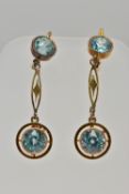 A PAIR OF YELLOW METAL, ZIRCON DROP EARRINGS, each earring is set with two circular cut blue zircons