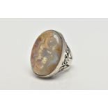 A WHITE METAL AGATE SINGLE STONE RING, the oval cut banded agate cabochon, collet set with