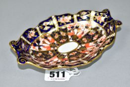 A ROYAL CROWN DERBY IMARI 2451 PATTERN TWIN HANDLED BONBON DISH, of wavy oval form, printed puce
