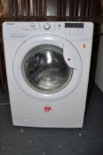A HOOVER VHW654D washing machine with instruction manual and water pipe (PAT pass and working)