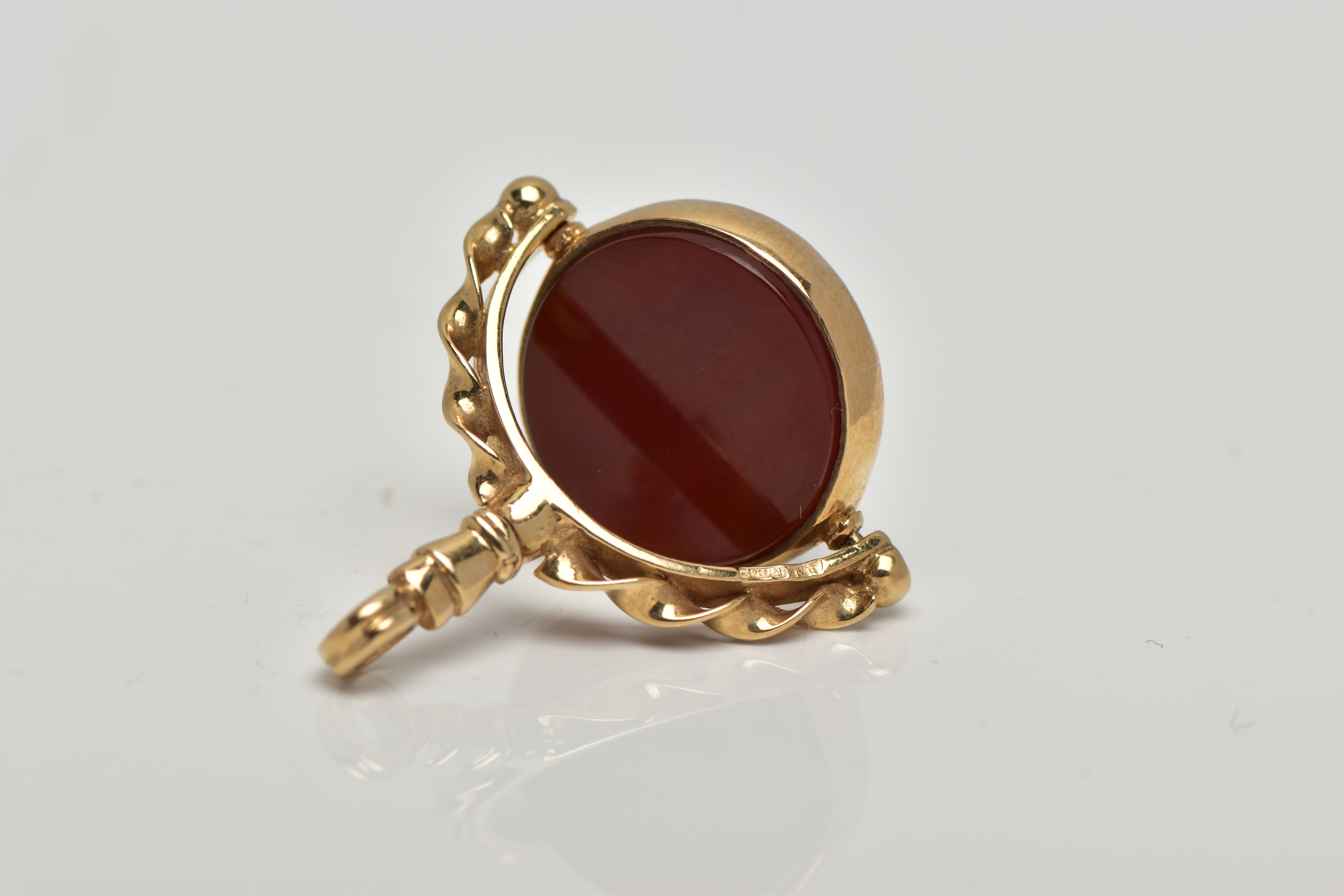 A 9CT GOLD HARDSTONE SWIVEL FOB, the bloodstone and carnelian circular panels, rotating to the - Image 2 of 4