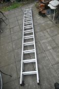 AN ALUNIUNIUM DOUBLE EXTENSION LADDER, approx. extended length 6.10m