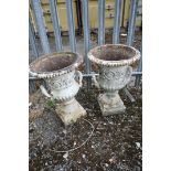 A PAIR OF CAST IRON CAMPAGNA GARDEN URNS, with twin handles, diameter 46cm x height 65cm (