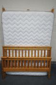 A 4F6 MATRESS, and a pine bed frame with slats (condition - general wear to frame)