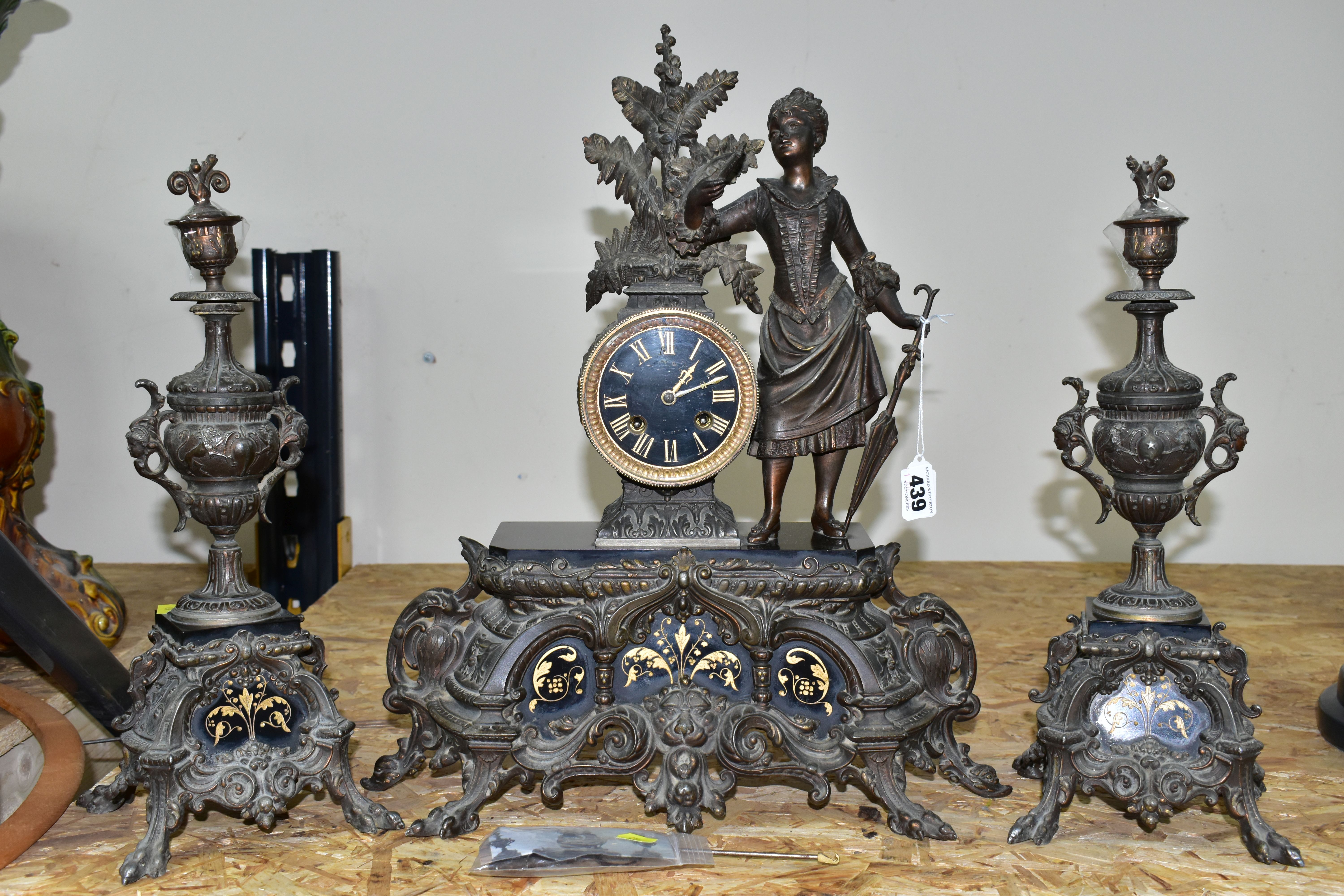 A CLOCK GARNITURE WITH GILT SLATE PANELS, the dial having gilt Roman numeral hour markers and worn