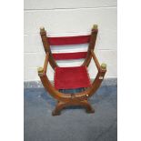 AN OAK FOLDING SAVONAROLA BISHOPS CHAIR, with brass caps, and red velour fabric, width 59cm x