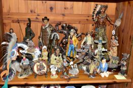 A COLLECTION OF WESTERN COWBOY AND INDIAN FIGURES, comprising mostly resin household ornaments of