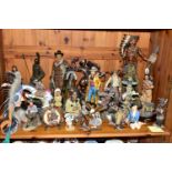 A COLLECTION OF WESTERN COWBOY AND INDIAN FIGURES, comprising mostly resin household ornaments of