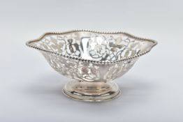 A FLORAL PIERCED BOWL, depicting various floral and foliate designs, with pierced intervals and