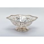 A FLORAL PIERCED BOWL, depicting various floral and foliate designs, with pierced intervals and
