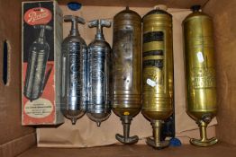 A BOX CONTAINING SIX VINTAGE CHROME, BRASS AND COPPER FIRE EXTINGUISHERS, including a boxed Junior
