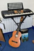 A YAMAHA PSR225 ELECTRONIC ORGAN WITH STAND, together with a pair of Columbian maracas, a