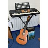 A YAMAHA PSR225 ELECTRONIC ORGAN WITH STAND, together with a pair of Columbian maracas, a