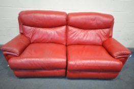 A RED LEATHERETTE THREE SEATER MANUAL RECLINER