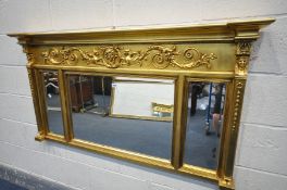 A REPRODUCTION REGENCY STYLE GILT FRAMED MIRROR, with triple bevelled edge plates, width 140cm x