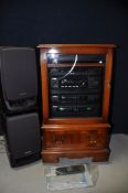 A AIWA Z1100 HI-FI SYSTEM with a pair of Aiwa SXZ1100 speakers with remote and instruction manual,